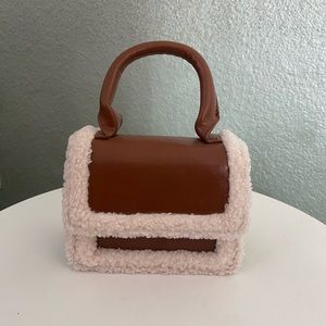 Mini Sherpa and vegan brown leather clutch
